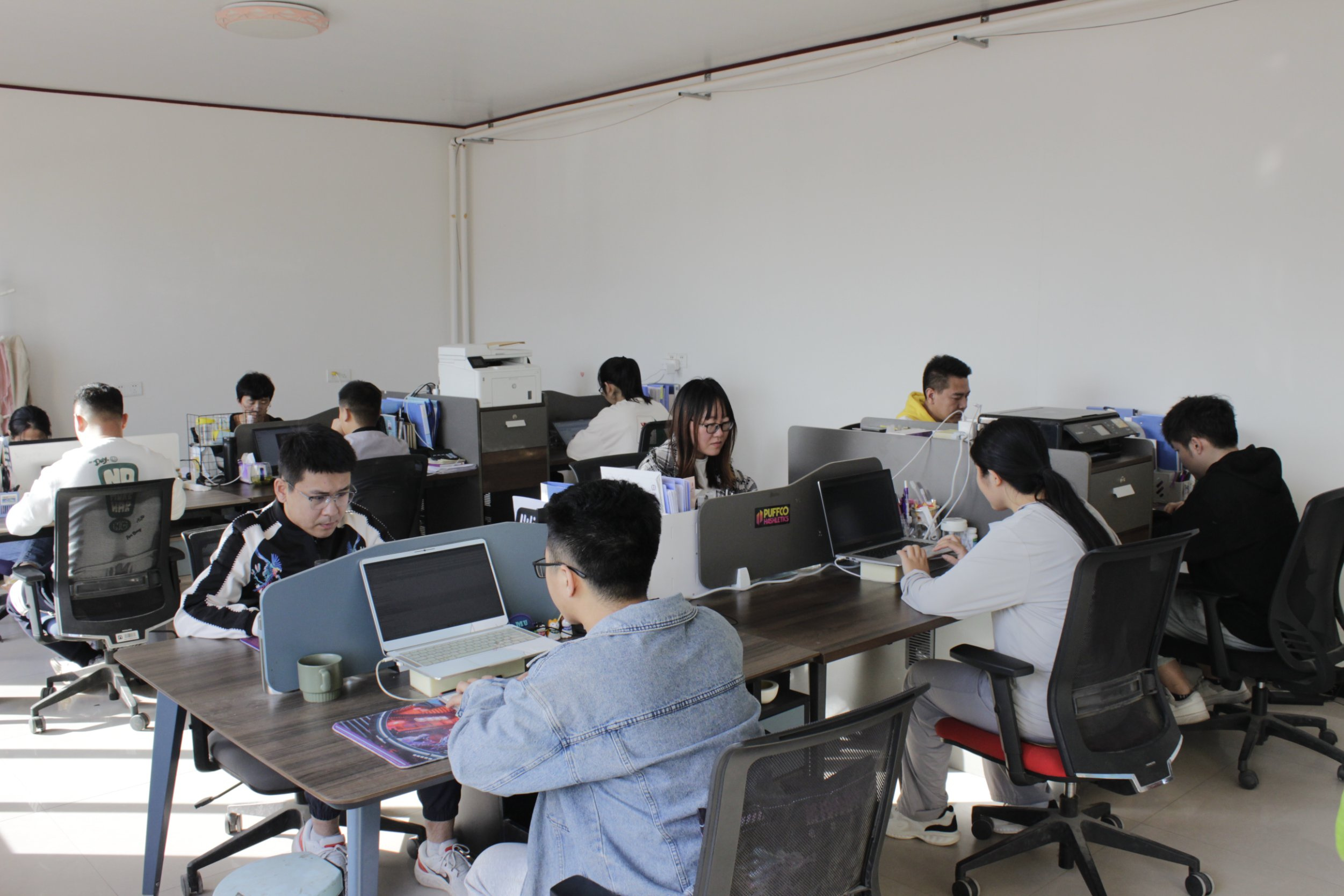 The Elfglass team collaborating in their office