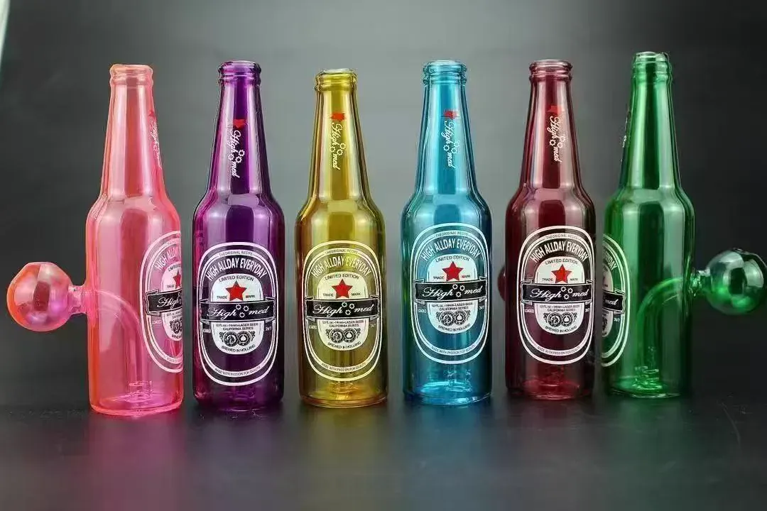 Six beer bottle shaped glass bongs in pink purple gold blue red green