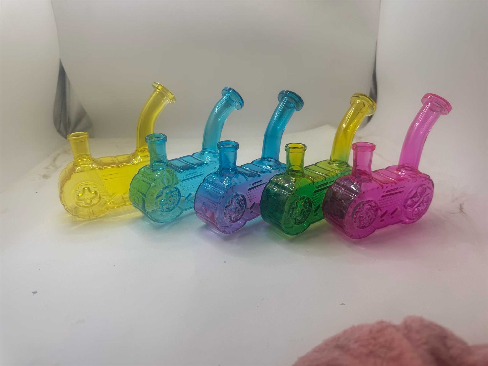 Colorful glass pipes displayed for retail — color preservation strategies apply