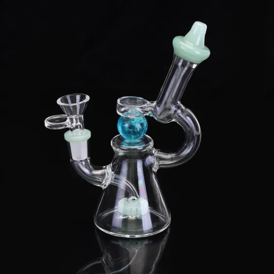 Clear glass dab rig with blue marble percolator sphere and green mouthpiece on black surface