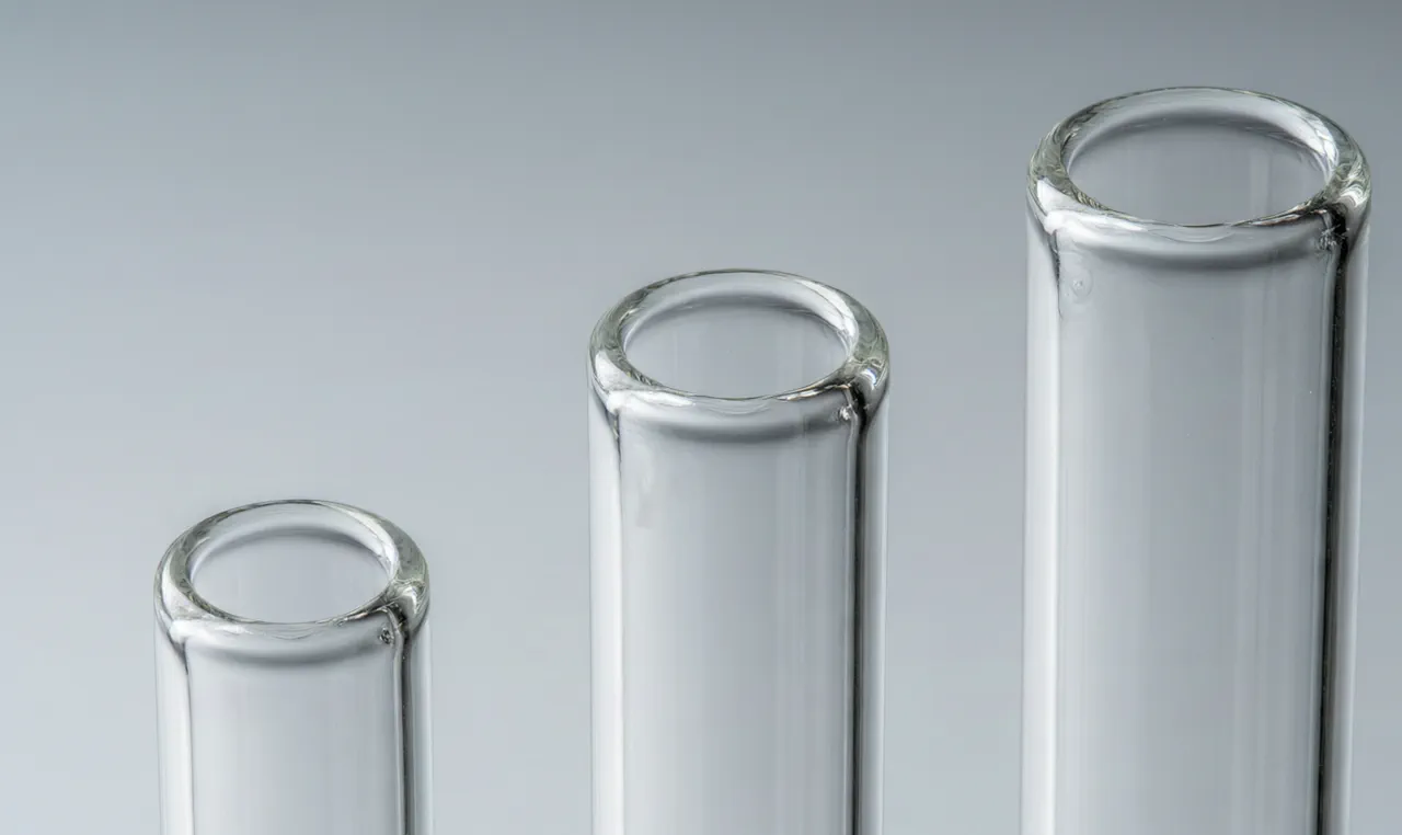 Three borosilicate glass tubes with 3mm, 4mm and 5mm wall thickness compared side by side