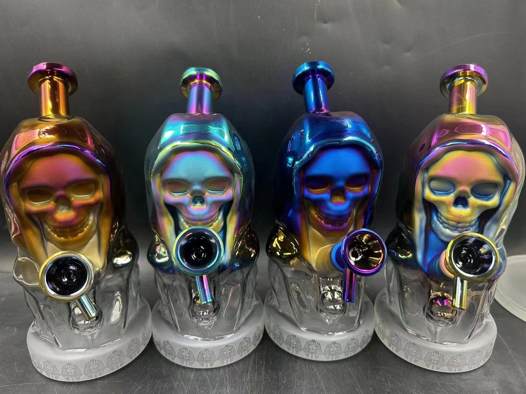 Wholesale steamroller pipes displayed alongside other hand pipe styles in a glass factory showroom