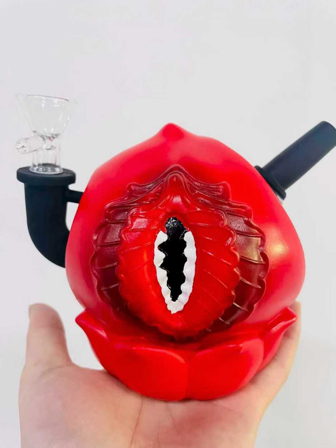 Lotus shaped glass bong with eye design sold under branded pricing policies