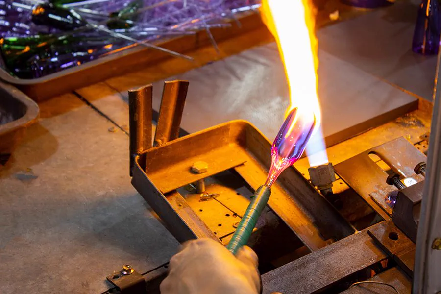 Glass pipe production process with exclusive custom molds and controlled file access