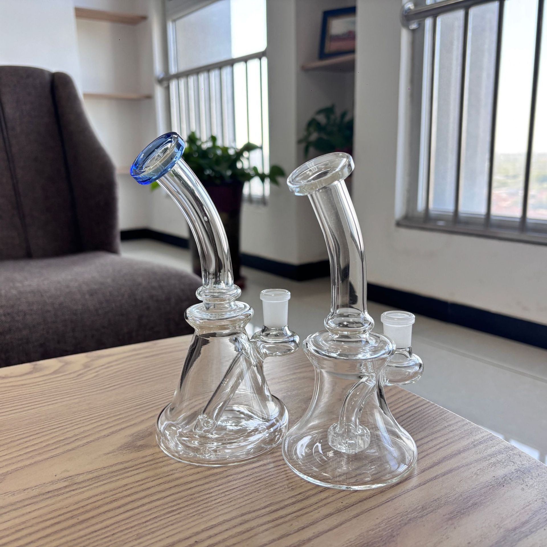 Glass water pipe checked during drop testing for impact resistance